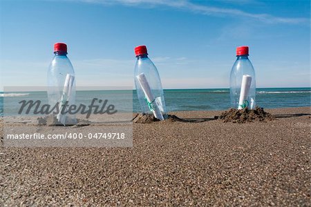 three messages in three plastic bottles