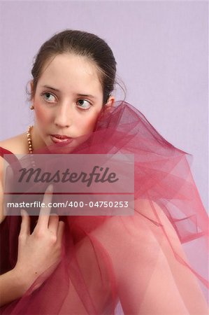 Teenage ballet dancer in a burgundy costume