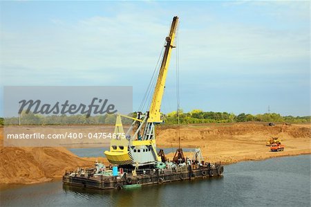 floating excavator - development sandpit with dredge