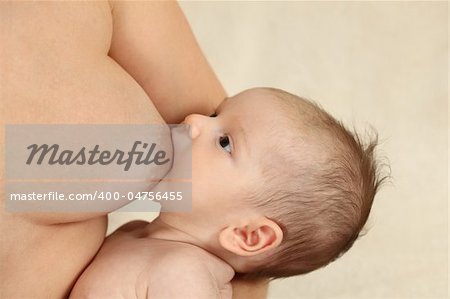 Mother breastfeeding her newborn baby