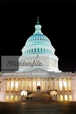 Capitol hill building at night illuminated with light, Washington DC.