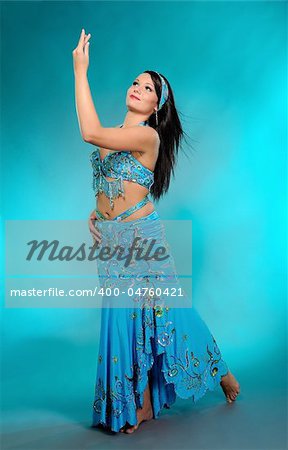 Beautiful sexy dancer woman in bellydance costume with pretty professional stage make-up