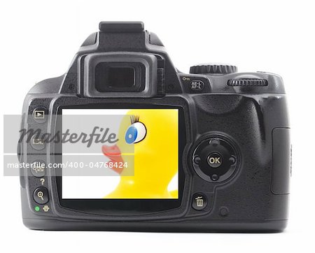 toy rubber duck iand digital camera isolated on white background