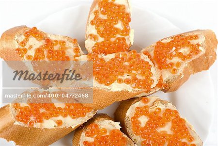 Sandwiches caviar at plate isolated on a white background