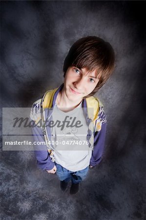 Hip-hop dancer posing on a dark background