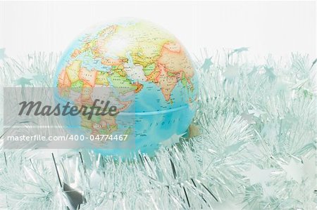 Globe with Tinsels on White Background