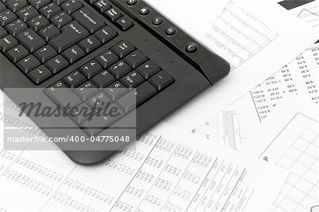 Financial balance. keyboard stands on stack document