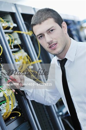 young handsome business man  engeneer in datacenter server room