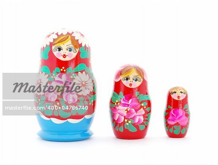 Russian nested dolls standing in a row on white background