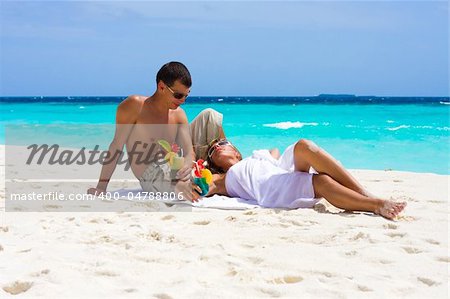 Honeymoon with cocktails on a tropical beach