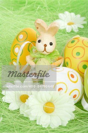 bunny and Painted Easter Eggs on green Grass