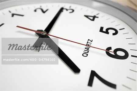 This photograph represent a wall clock. Arrows indicates 7:15 - Time to go to work!