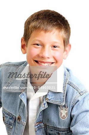 young attractive boy wearing a blue jean jacket and smiling