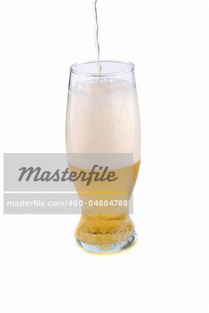 Lung of golden colour beer in a glass.