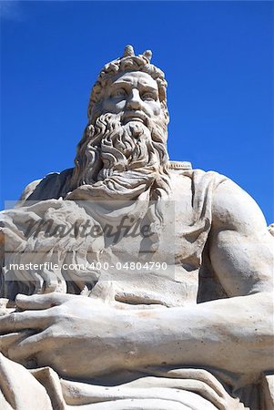 Statue from sand against the blue sky of the mythical hero.