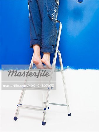 Painting Girl on a step ladder