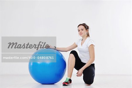 beaudiful young woman fitness workout with weights at sport club