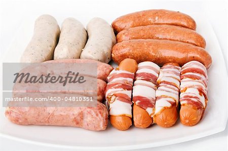Some kind sausages on white plate