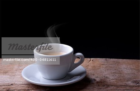 Hot Coffee in white cappuchino cup on wooden table