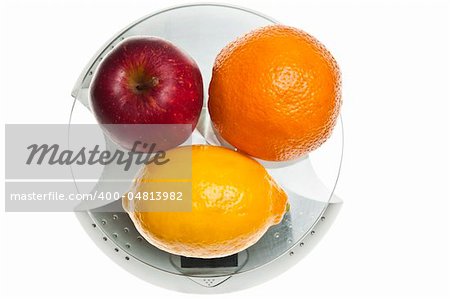 Mix of fruits isolated on food scale