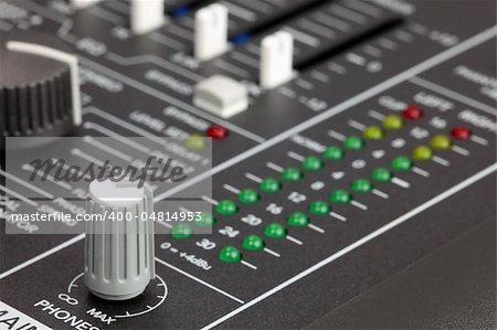 Closeup of audio mixing console. Shallow depth of field