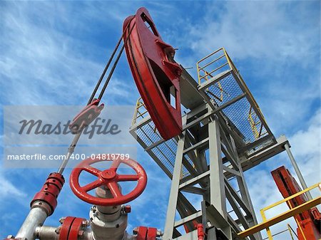Oil pump jack in work. Wide angle