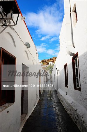 Narrow Alley With Old Buildings In Typical Greek City