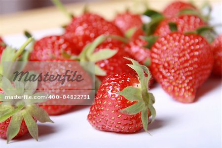 The ripe strawberry lies on a table