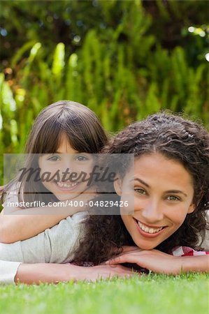 Adorable mother with her daughter in the garden