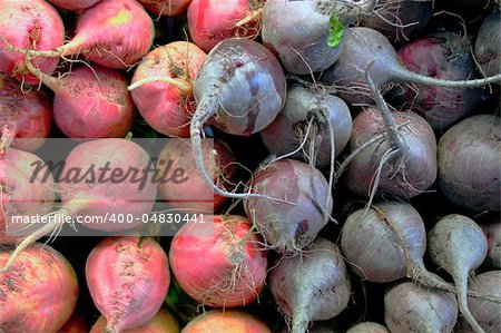 Red and purple beets piled up at farmer's market