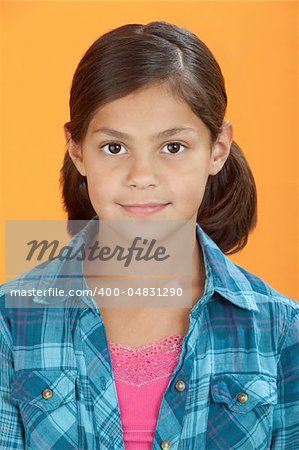 Cute Latina girl isolated on an orange background