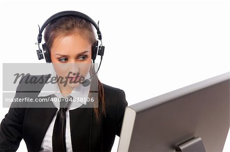 pretty girl with a headset works at the computer
