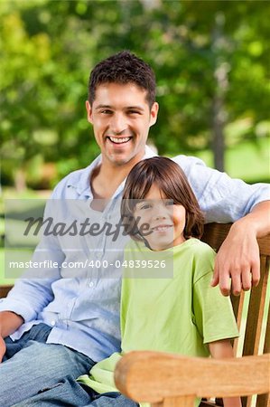 Son with his father on the bench