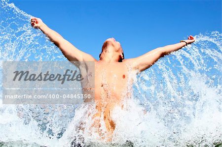 Splashing men in water.