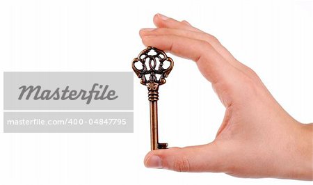 Hand holding a key in white background