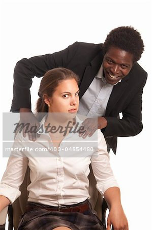 young woman beeing  touched by a fellow coworker