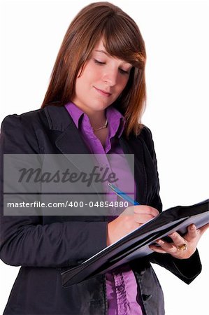 A young businesswoman is writing in her agenda.
