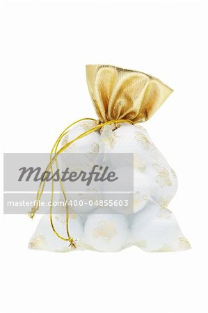 Golf balls in gift sachet on white background