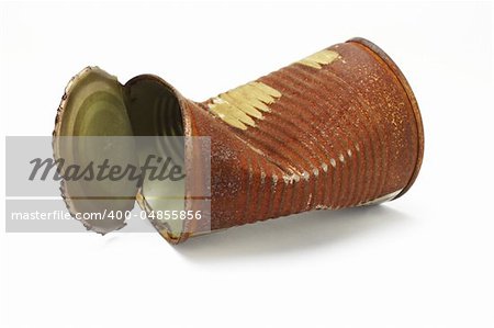 Old rusty crumbled tin can on white background