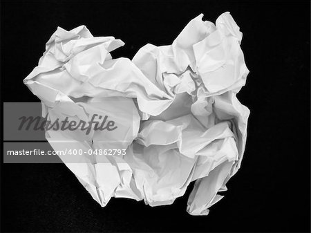 Crumpled White paper on a black background