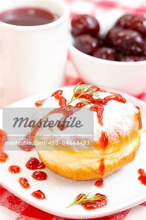 Delicious donut with jam and plums