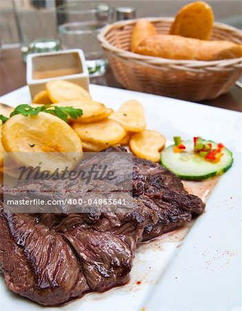 juicy steak beef meat with tomato and potatoes