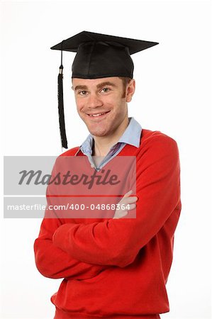 young man standing with graduation hat on
