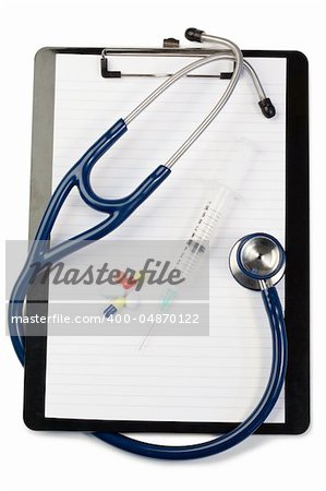 Note pad with blue stethoscope and pills on a white background