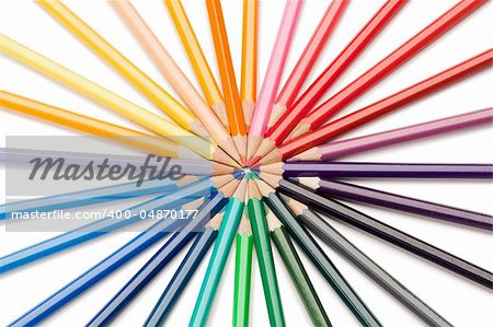 Top view of color pencils star on a white background