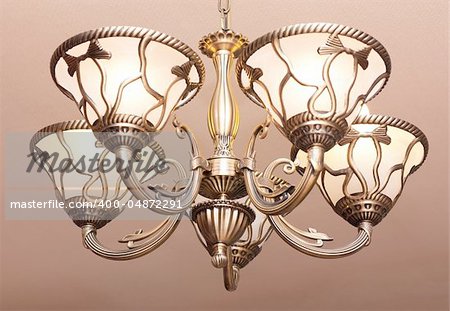 Contemporary old fashioned steel five light chandelier. Digital photograph.