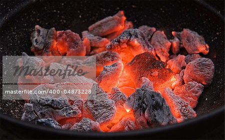 Red hot burning charcoal preparing for grilling.Barbecue grill.Soft focus.l