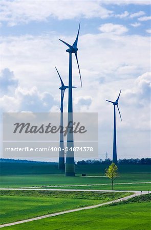 Spring landscape with wind turbine towers.