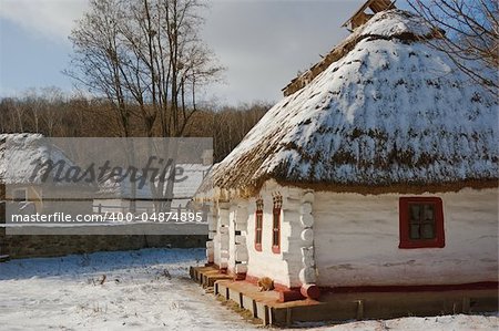old rural whitewashed house with a thatched roof