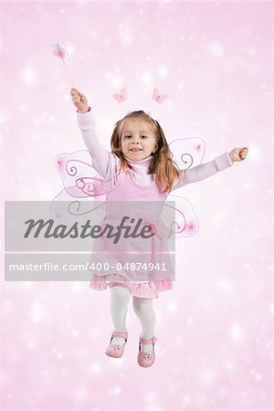Little girl in fairy costume on white background